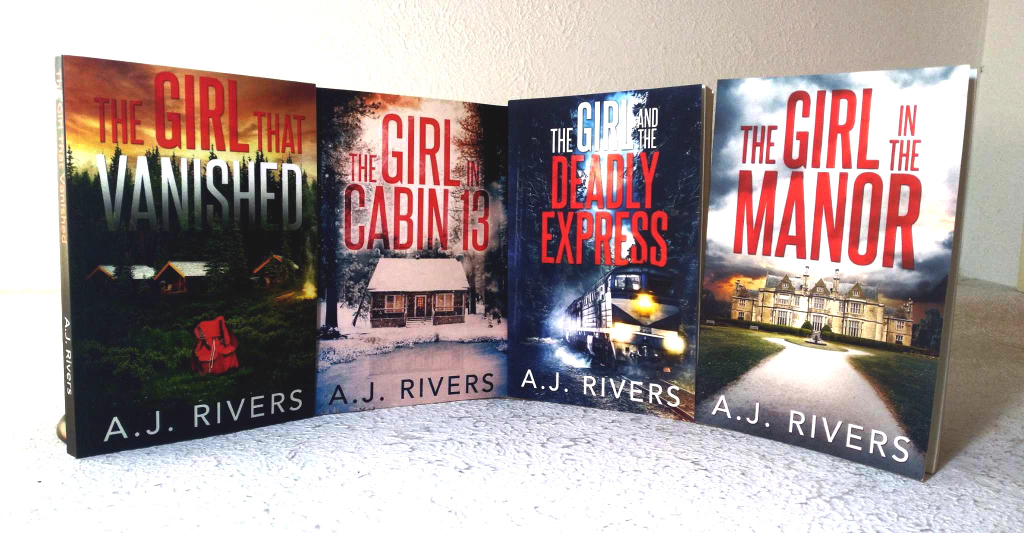 A lot of four (4) A.J. Rivers mystery novels; The Girl in the Manor; The Girl and the Deadly Express; The Girl That Vanished; The Girl in Cabin 13