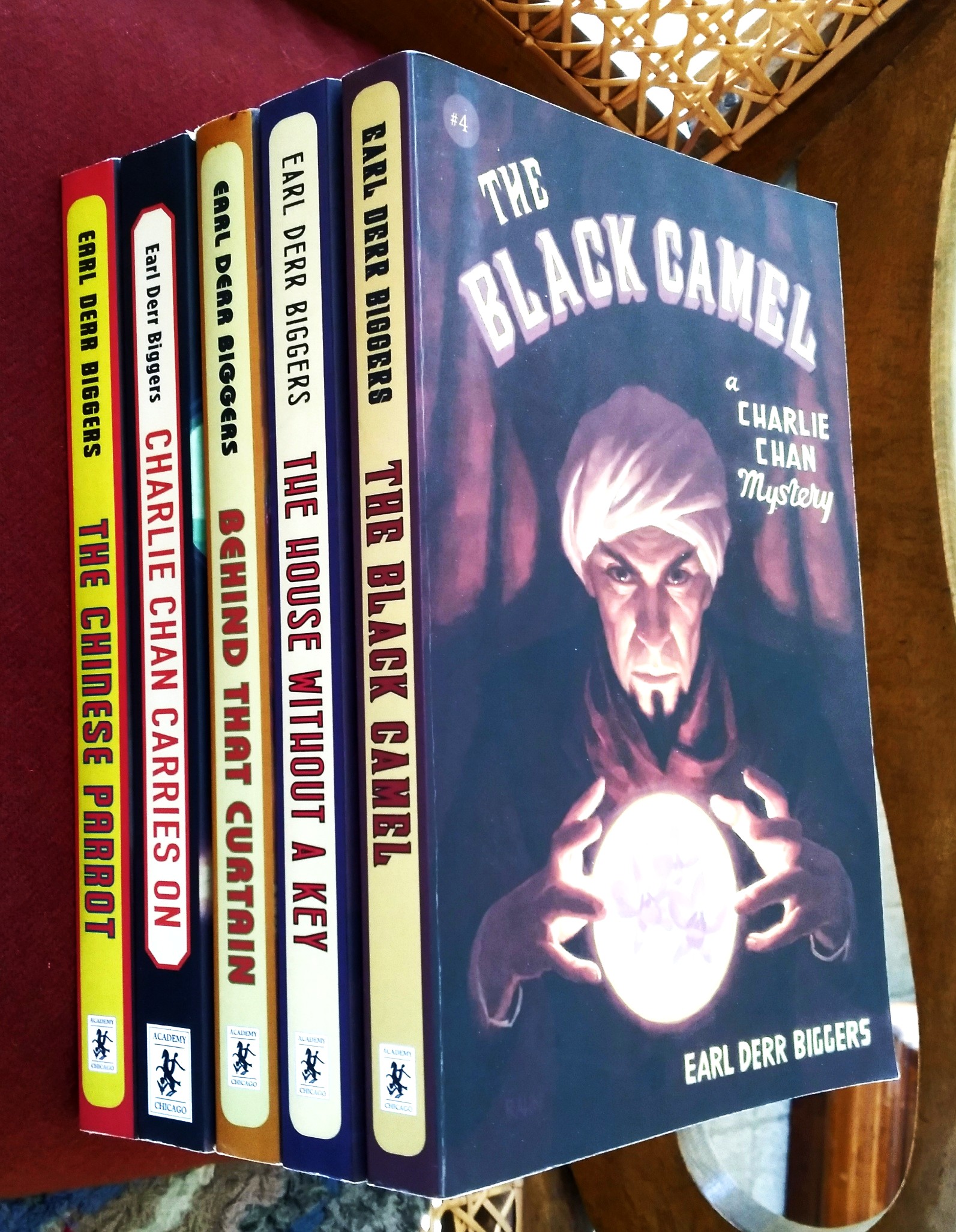 A lot of five (5) Charlie Chan mysteries: The Black Camel; The House Without a Key; Behind That Curtain; Charlie Chan Carries On; The Chinese Parrot